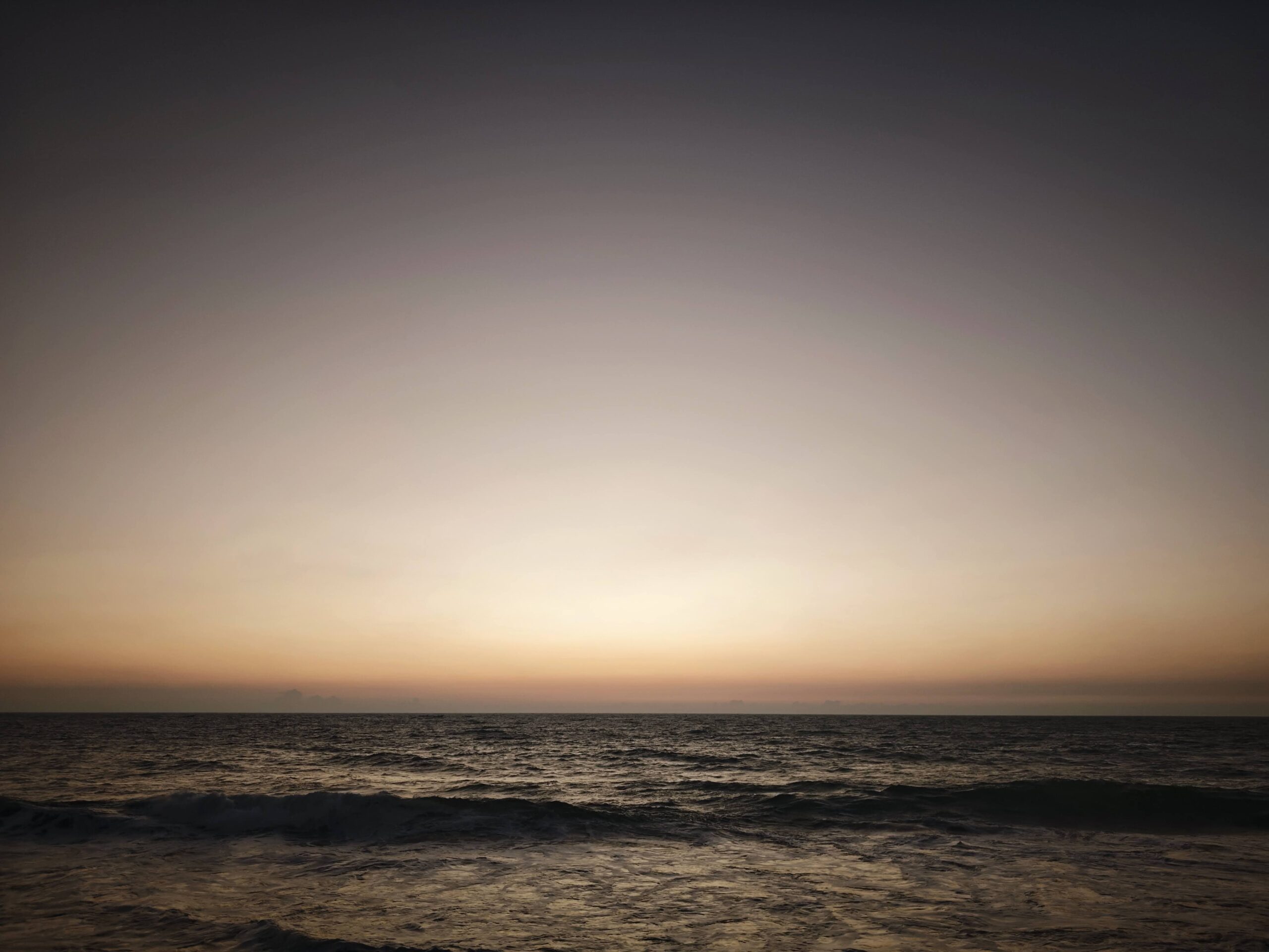 Image represents the beach at dawn